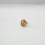 Slight side angle view of the floral design gold nose pin on a white background highlighting depth and detailing