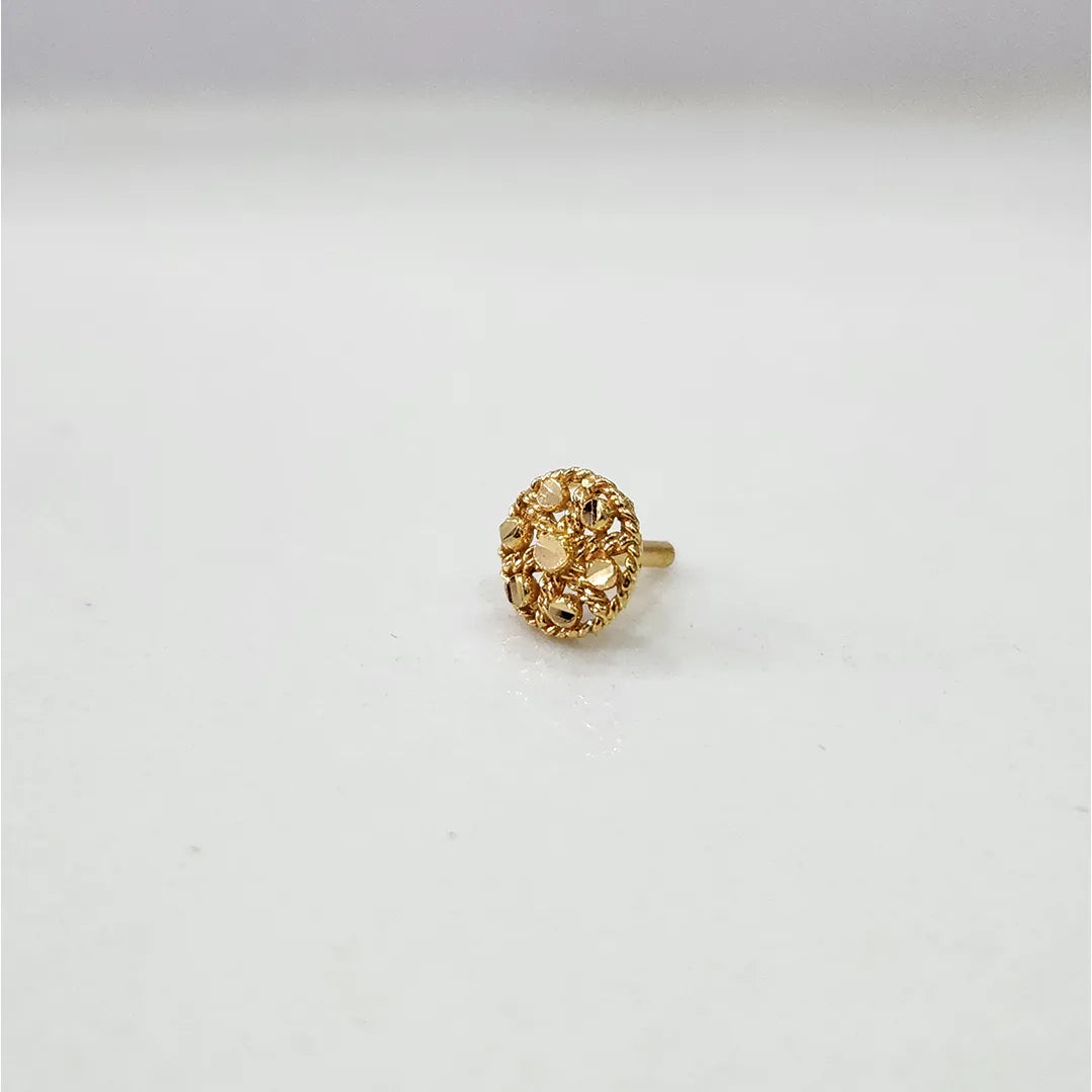 Slight side angle view of the floral design gold nose pin on a white background highlighting depth and detailing