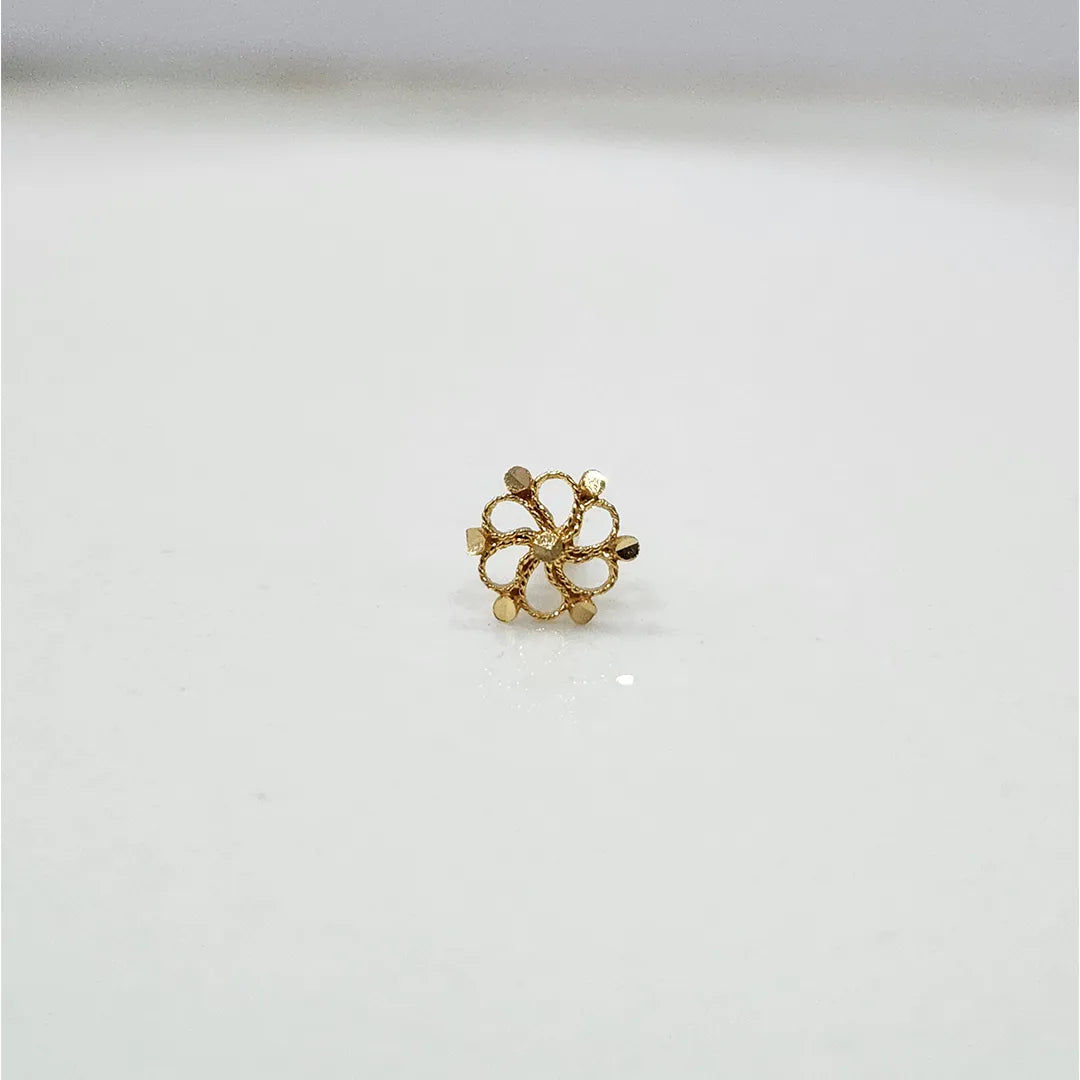 Front view of a small floral 18K nose pin gold placed on a clean white background showing fine detailing
