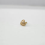 Front view of tiny 18K heart gold nose pin on a white background showing fine detailing
