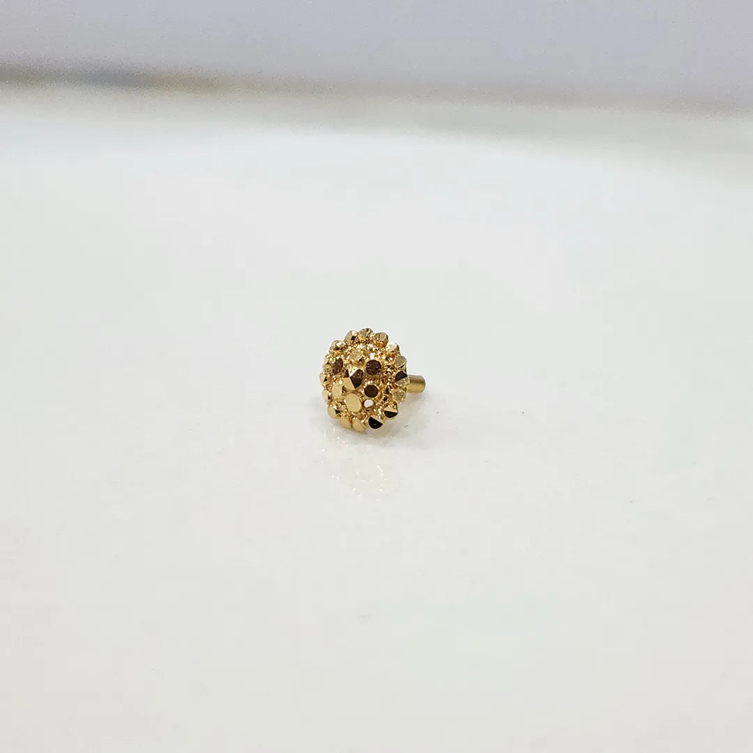Side angle view of the round floral inspired 18K gold nose pin on a white background highlighting the secure post and back finish