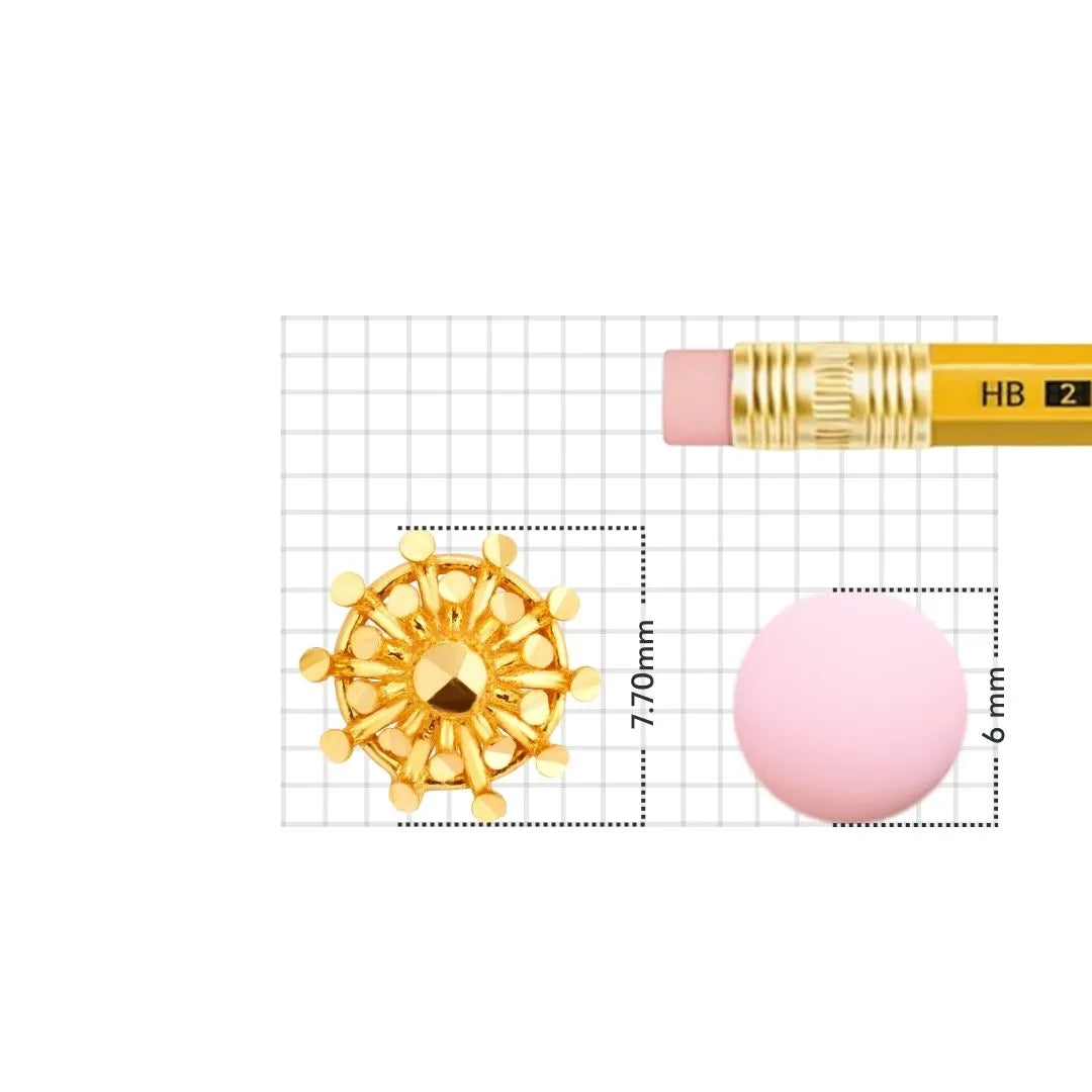 Gold nose pin displayed beside pencil for size comparison showing compact handcrafted structure