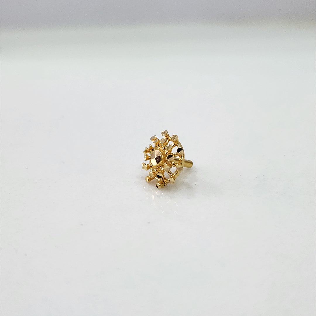 Side view of elegant 18k gold nose pin design with floral detailing showcasing classic indian jewellery style