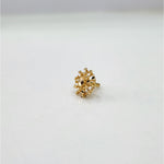Side view of elegant 18k gold nose pin design with floral detailing showcasing classic indian jewellery style