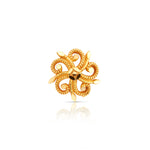 Front view of intricate swirl design 18K gold nose pin on a white background showcasing detailed craftsmanship