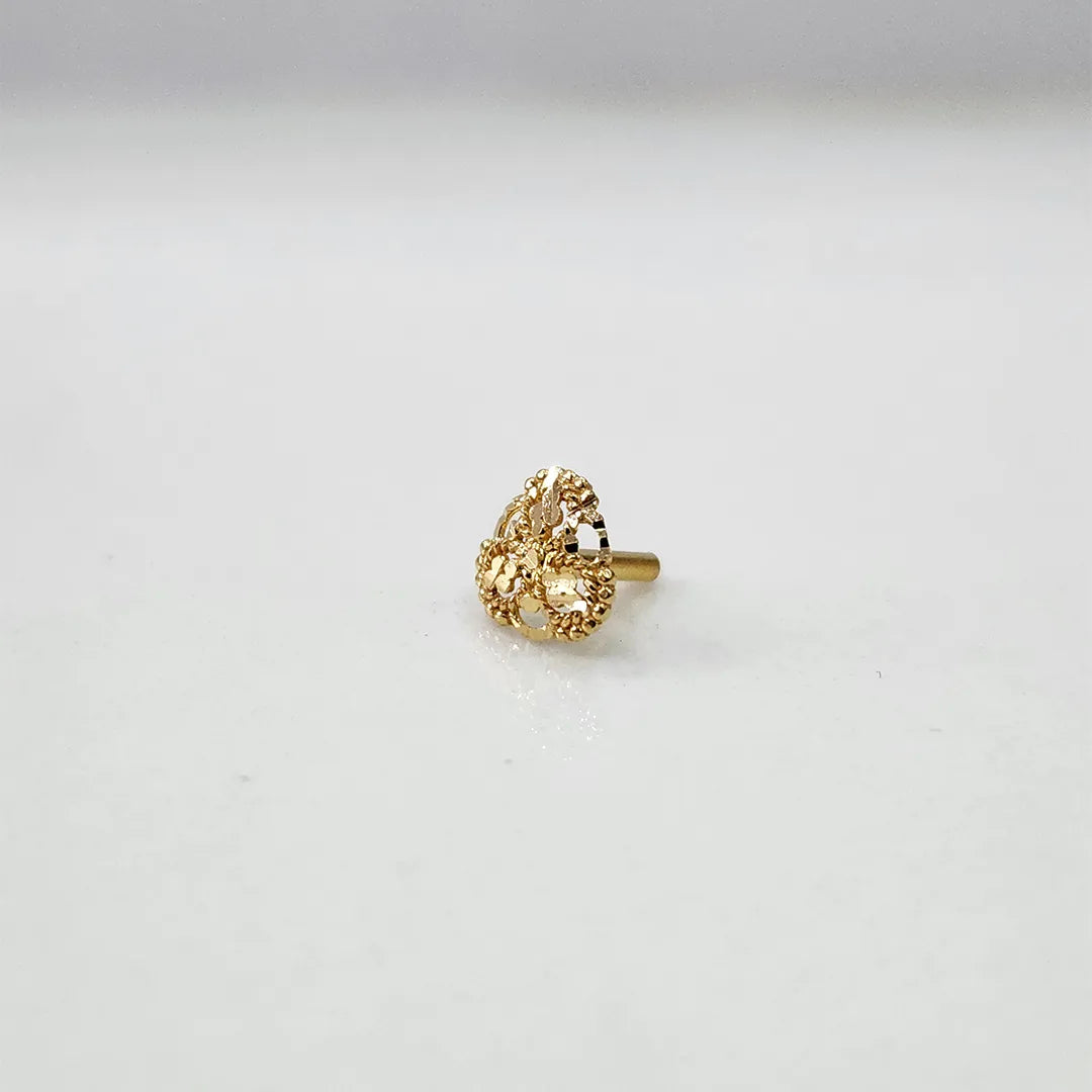 Side angle view of petite floral 18K gold nose pin on a white background highlighting its small size and lightweight build