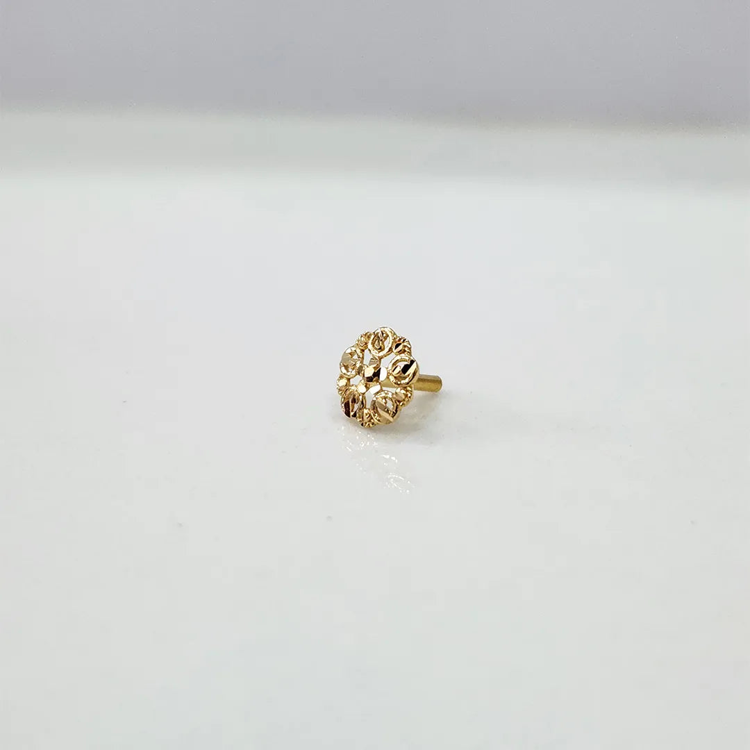 Small floral 18K nose pin gold displayed on a white background showing delicate craftsmanship