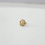 Front view of small floral motif 18K gold nose pin on a white background displaying detailed craftsmanship