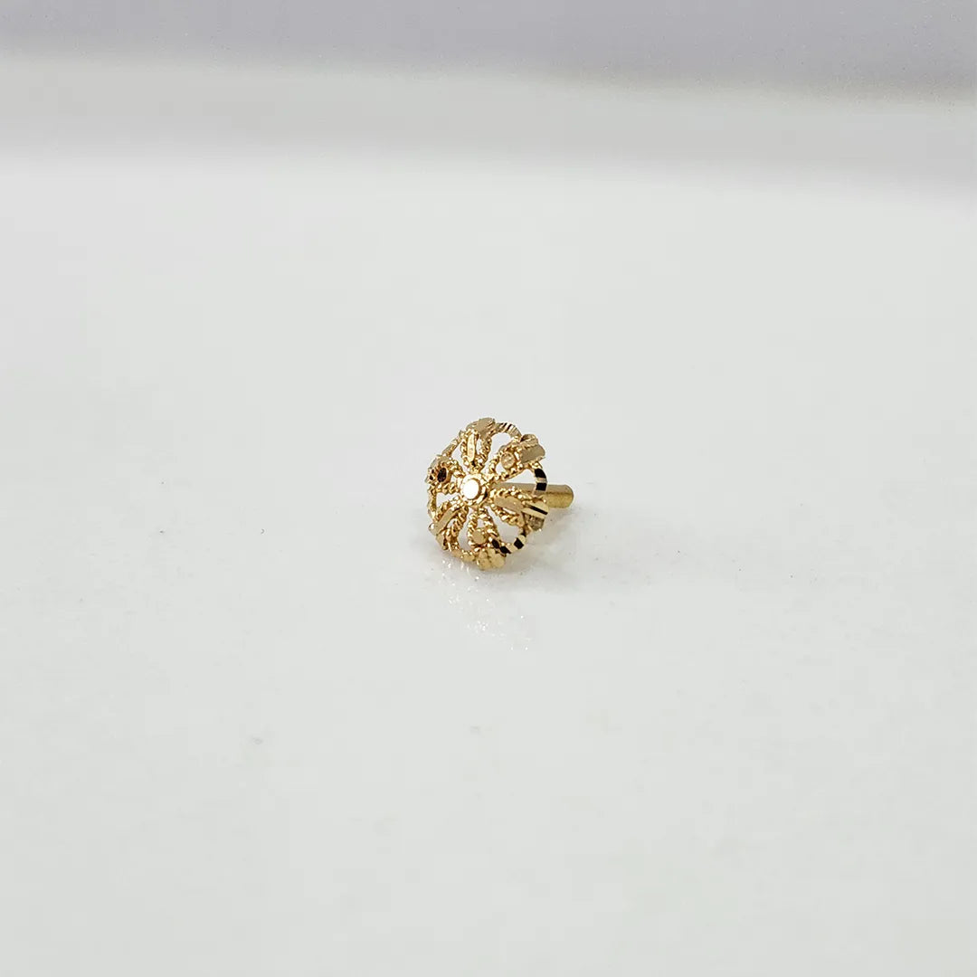 Front view of small floral motif 18K gold nose pin on a white background displaying detailed craftsmanship