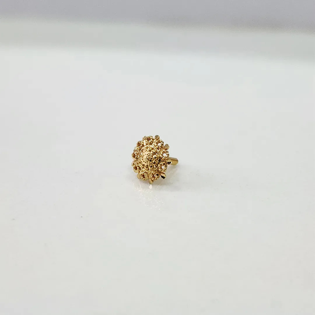 Side angle of the floral gold nose pin on a white background highlighting its compact size and smooth polish