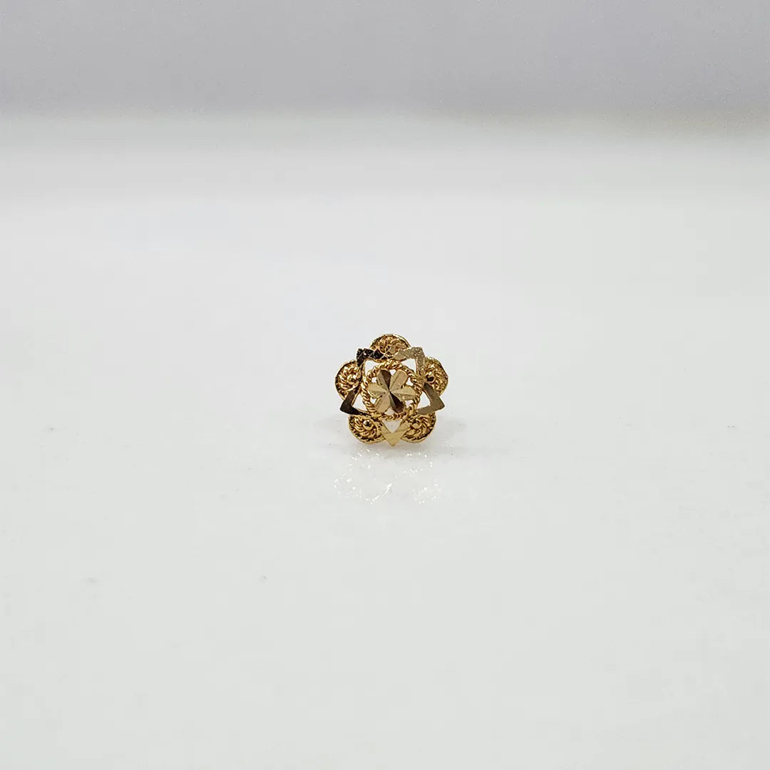 Side angled view of the floral 18K gold nose pin on a white background showing depth and craftsmanship
