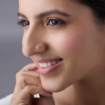 Woman wearing elegant gold nose pin design showcasing classic indian jewellery style for daily use