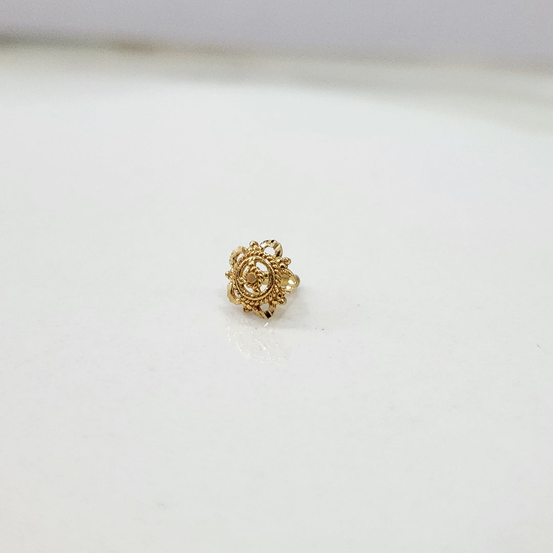 Side angle view of 18k gold nose pin design with floral motif ideal for indian women seeking timeless elegance