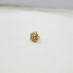 Side angle view of 18k gold nose pin design with floral motif ideal for indian women seeking timeless elegance