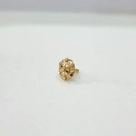 Front view of floral gold nose pin design displayed on a clean white background