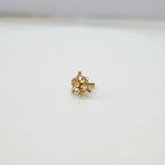 Tiny cluster patterned 18K gold nose pin displayed on a white background showing fine detailing