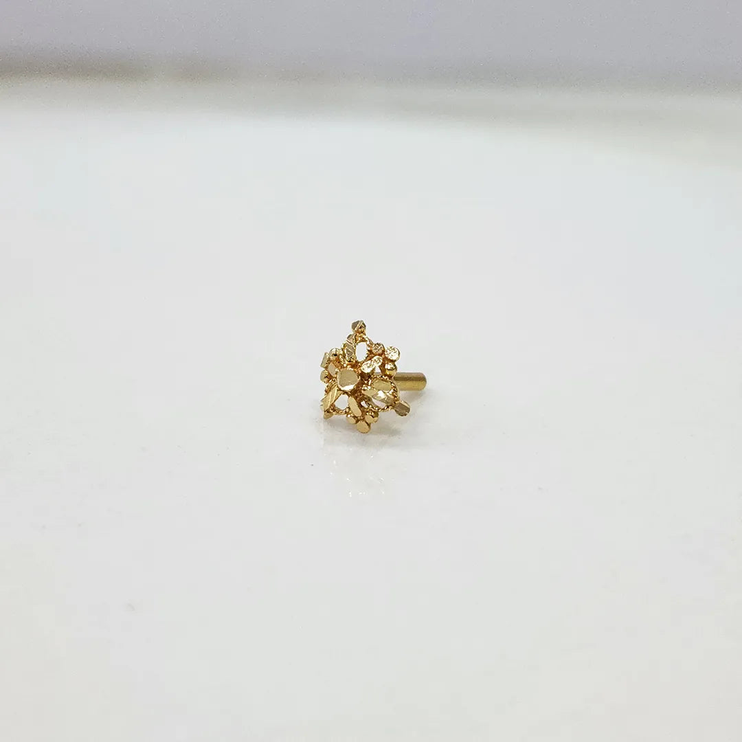 Tiny cluster patterned 18K gold nose pin displayed on a white background showing fine detailing