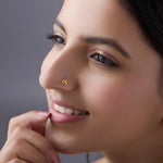 Woman wearing floral 18K nose pin gold showcasing an elegant and minimal everyday look