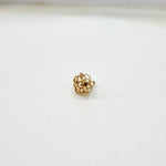 Front view of small floral 18K gold nose pin on a white background showing compact size and fine detailing