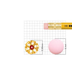 Close-up of 18K nose pin gold placed on a measurement grid beside a pencil showing accurate 5.50 mm dimensions for size reference