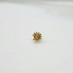 Small sun-design 18K nose pin gold captured on a clean background showing fine detailing