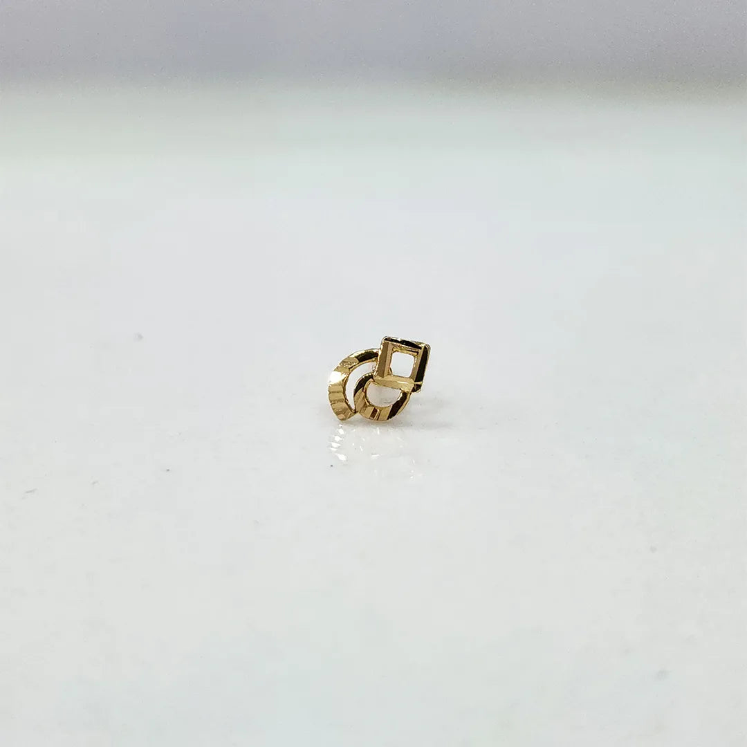 Small geometric 18K nose pin gold captured on a clean background highlighting its polished finish