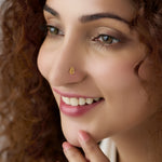 Woman wearing geometric 18K nose pin gold showing a stylish and elegant everyday ethnic look