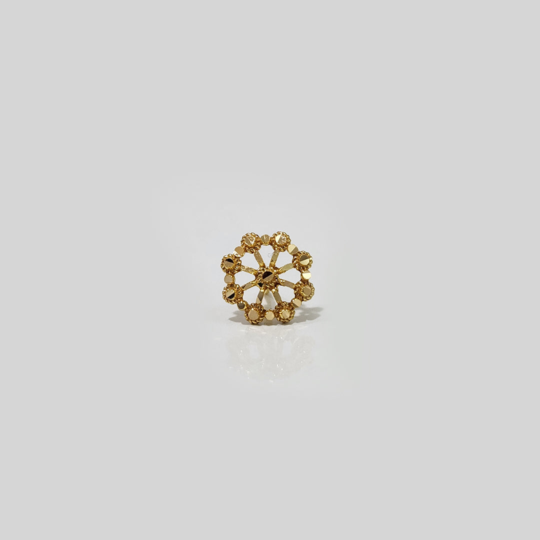 Minimal studio shot of floral gold nose pin design — 22k style indian gold nose pin for women.