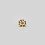 Minimal studio shot of floral gold nose pin design — 22k style indian gold nose pin for women.