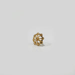 Side profile of modern gold nose pin design — handcrafted 18k small gold nose pin with traditional indian detailing.