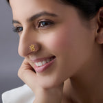 Woman wearing elegant maharashtrian gold nose pin showcasing cultural crescent design and intricate detailing