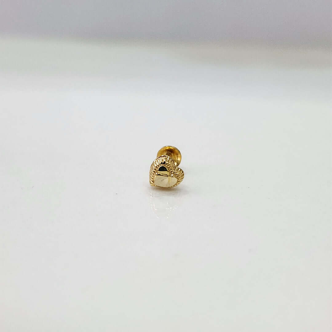 Front view of tiny heart 18K nose pin gold on a clean white background showing its delicate shape