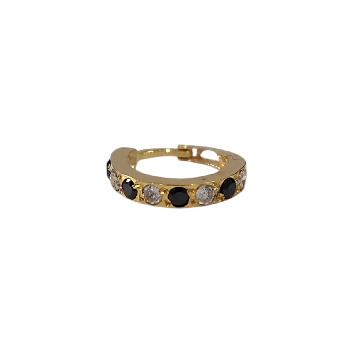 Vertical close up of stone studded 18K gold hoop nose ring on a white background highlighting its sleek circular design