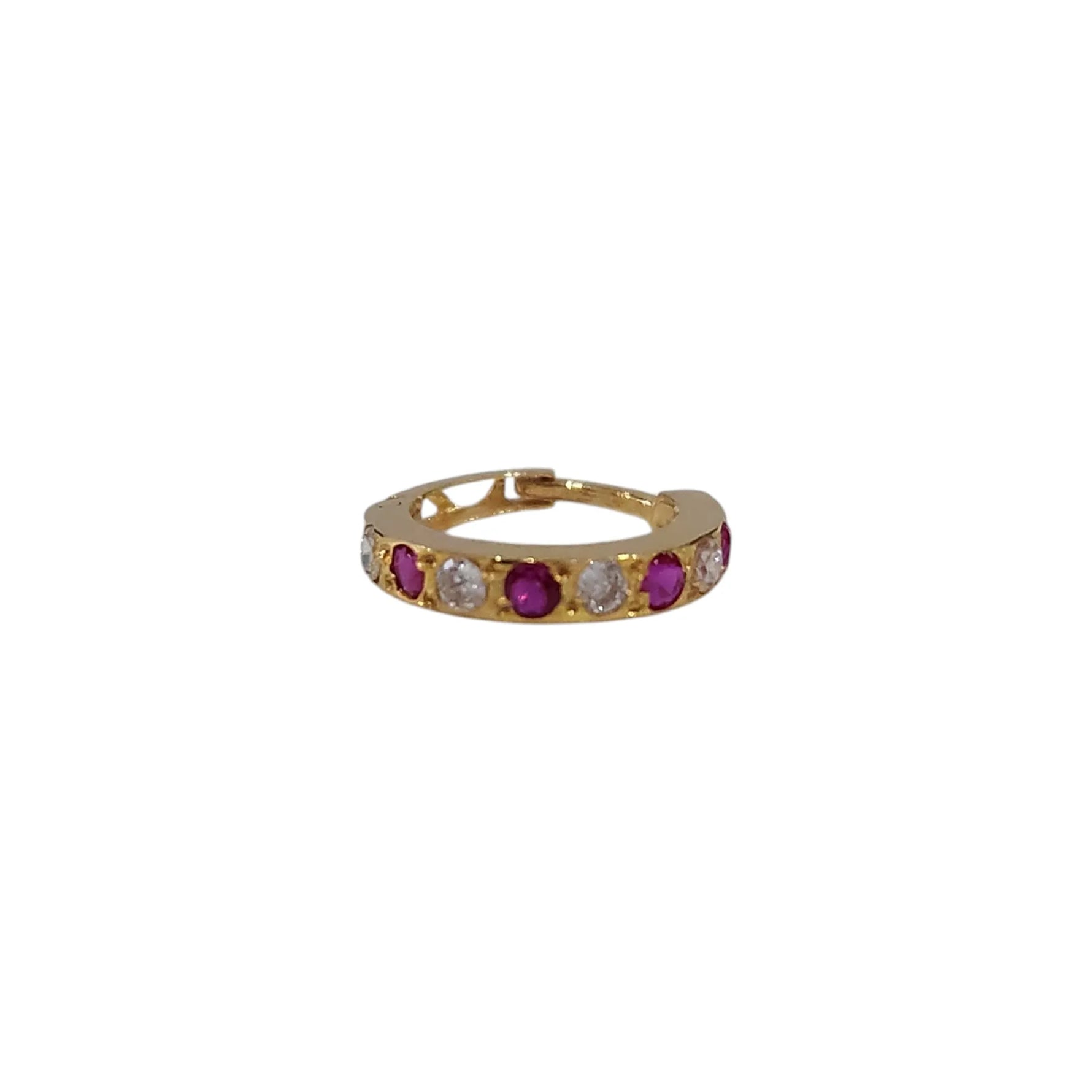 Front view of gemstone set gold nose ring on a white background displaying circular design