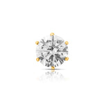 Top view of single white stone gold nose pin highlighting sparkle and symmetry