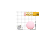 Size reference image of white stone nose pin in gold shown on measurement grid