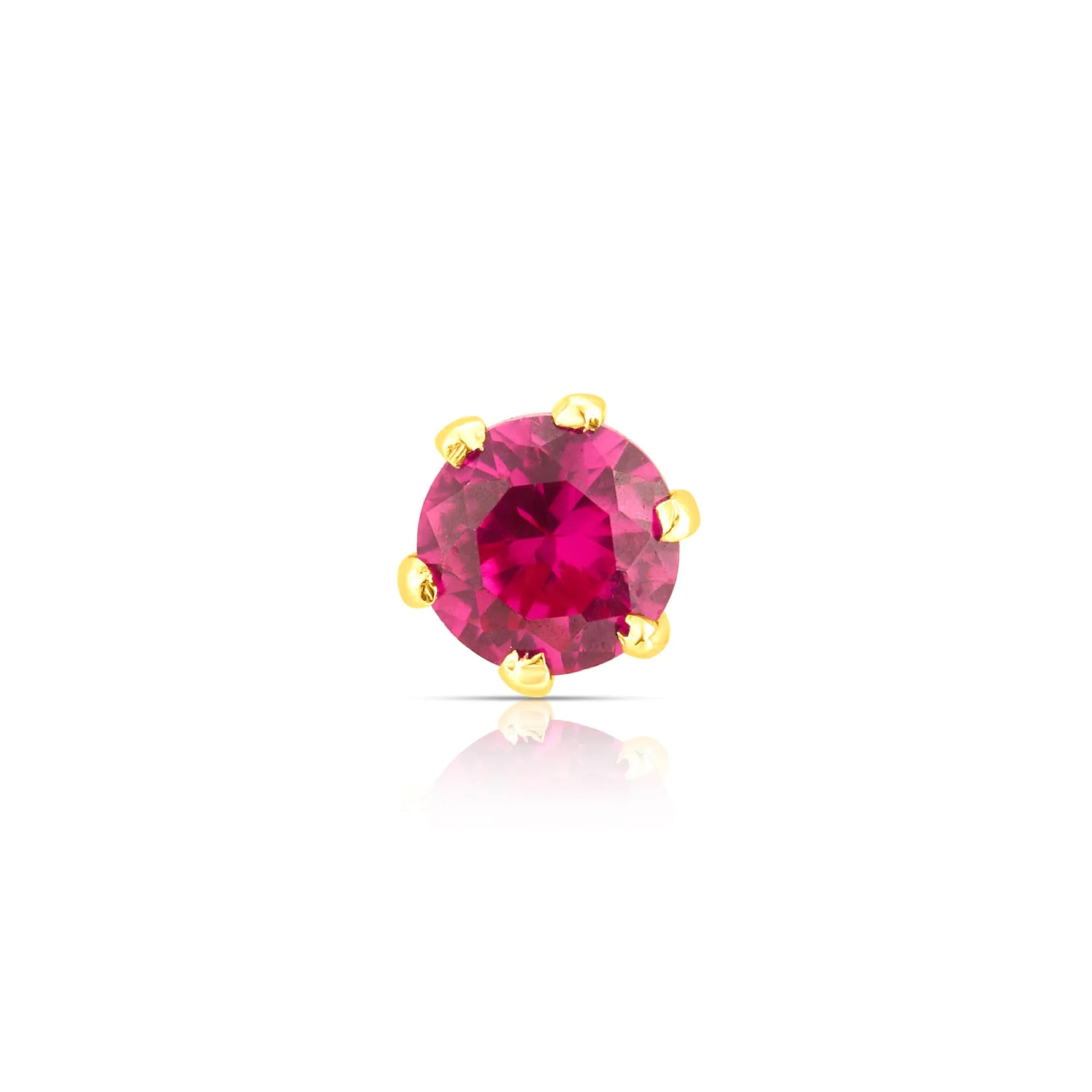 Front view of round ruby stone nose pin in gold prong setting