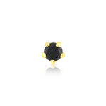 Front view of round black stone nose pin in gold setting