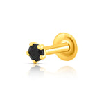 Front view of round black stone nose pin in gold setting