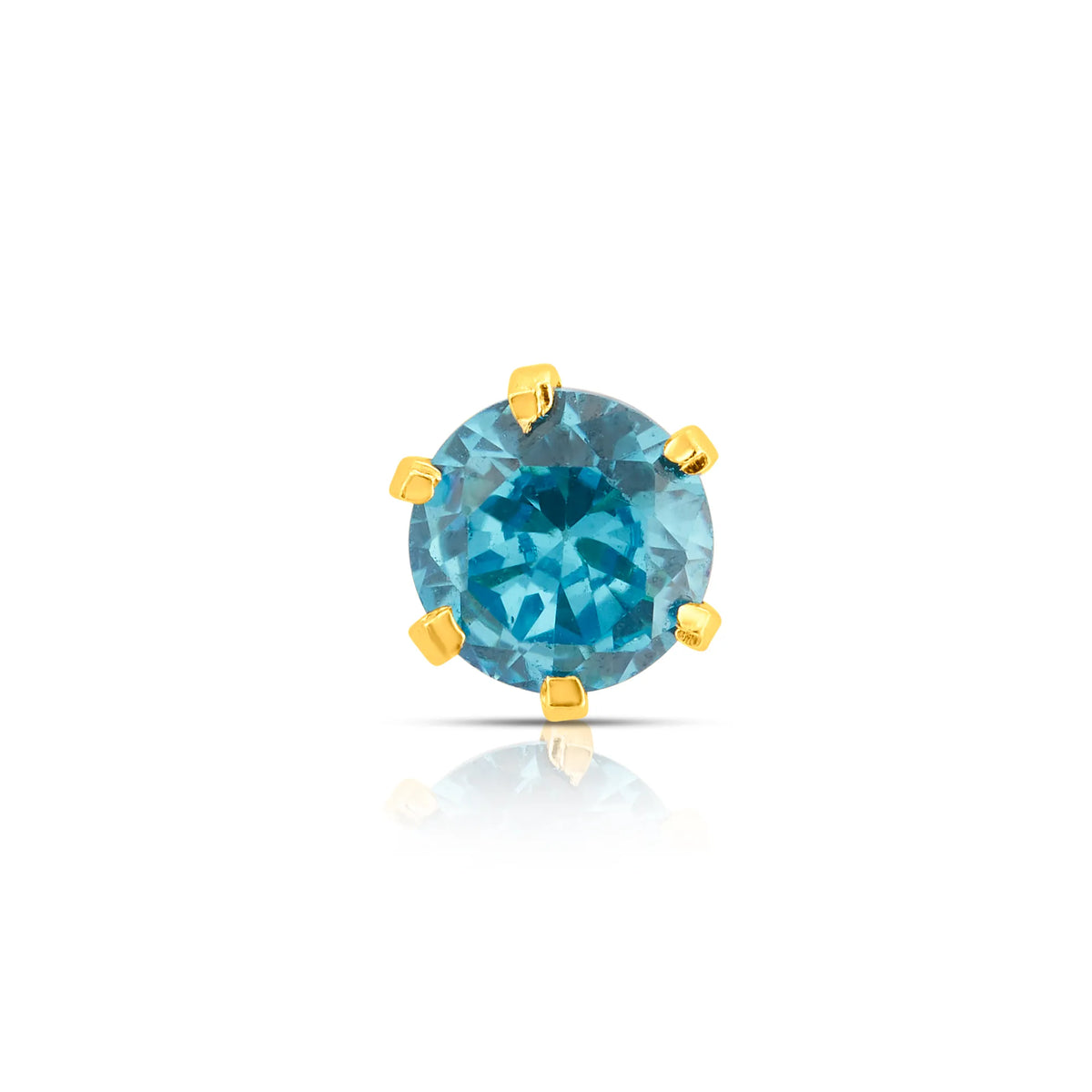 Close up of blue gemstone gold stone nose pin with prong setting