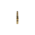 Side profile view of slim 18K gold nose ring on a white surface showing its narrow band design