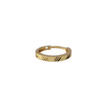 Top view of minimal 18K gold nose ring on a white background highlighting smooth circular finish