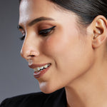 Model profile wearing a plain 18K gold hoop nose ring showcasing understated everyday styling