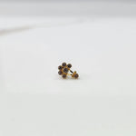 Antique-style gold ring with amethyst-toned stones plus hanging accent