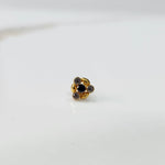 Gold ring with black onyx leaf-petal design, front view
