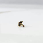 Gold ring with black onyx branch-style gemstone cluster, side view