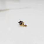 Gold ring with blue sapphire floral dangle design, side view