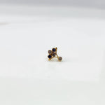Gold ring with blue sapphire branch-style gemstone cluster, side view