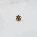 Front view of gold ring with layered clear gemstone petals