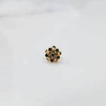 Front view of gold ring with layered green and clear gemstone petals